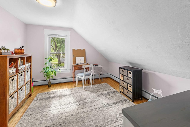 1515 Rugby St, Oshkosh, WI 54902 - office space featuring vaulted ceiling, wood finished floors, a baseboard radiator, and a textured ceiling