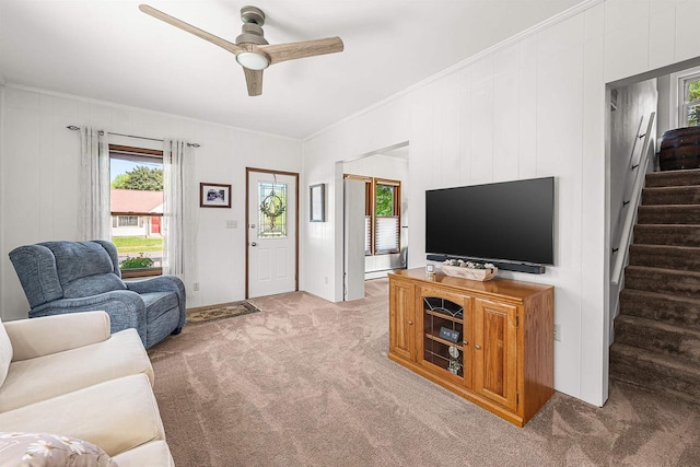 1515 Rugby St, Oshkosh, WI 54902 - carpeted living area featuring crown molding, a ceiling fan, stairway, and a baseboard heating unit