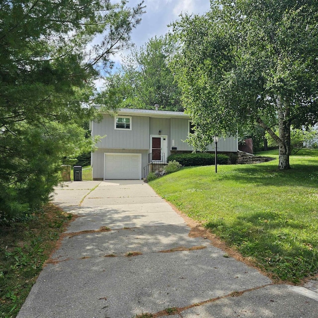 4106 School Rd, Madison, WI 53704 - raised ranch with a garage, concrete driveway, and a front yard