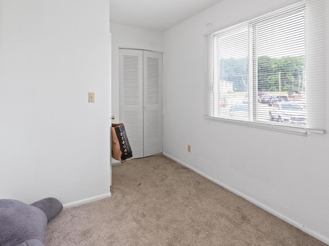 8871 N Swan Rd Unit K, Milwaukee, WI 53224 - carpeted bedroom featuring a closet and baseboards