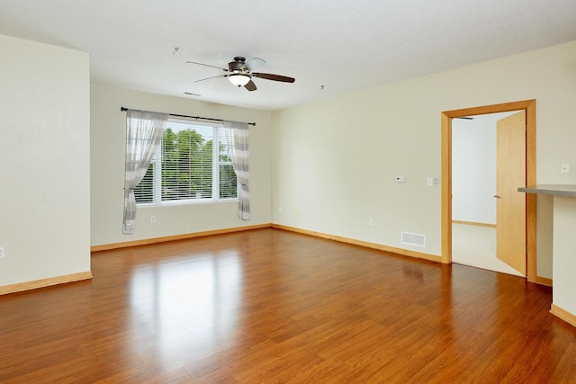 10900 W Bluemound Rd Unit 215, Wauwatosa, WI 53226 - empty room featuring wood finished floors and ceiling fan