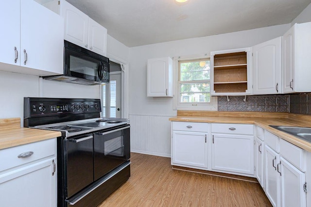 415 Broadway Ave, Wausau, WI 54403 - kitchen featuring black appliances, light wood finished floors, white cabinetry, a wainscoted wall, and open shelves