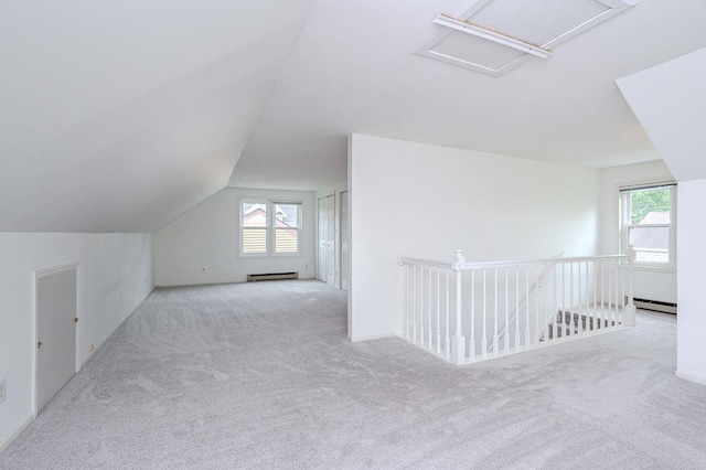 415 Broadway Ave, Wausau, WI 54403 - bonus room featuring carpet, baseboard heating, and lofted ceiling