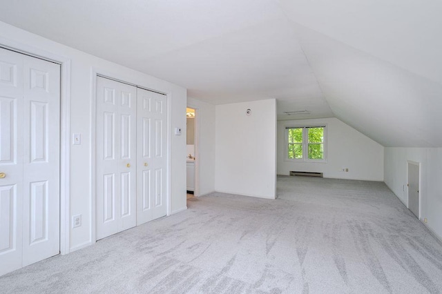 415 Broadway Ave, Wausau, WI 54403 - bonus room with a baseboard radiator, vaulted ceiling, and carpet