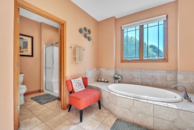 8668 47th Ave, Kenosha, WI 53142 - full bathroom featuring a bath, a stall shower, and tile patterned flooring