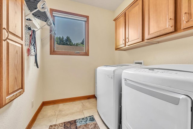 8668 47th Ave, Kenosha, WI 53142 - laundry room featuring independent washer and dryer, cabinet space, and light tile patterned floors