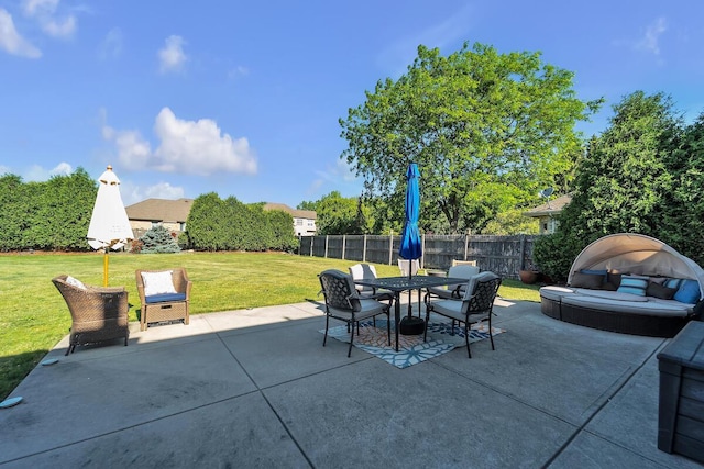 8668 47th Ave, Kenosha, WI 53142 - fenced backyard featuring a patio area and outdoor dining area