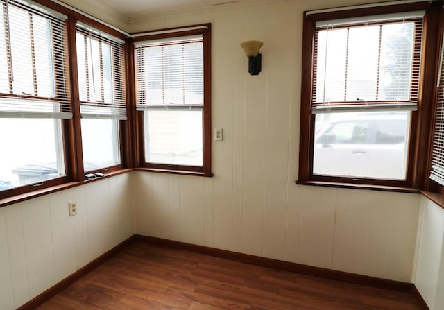 322 E N Ave, Little Chute, WI 54140 - empty room with plenty of natural light and dark wood-style flooring