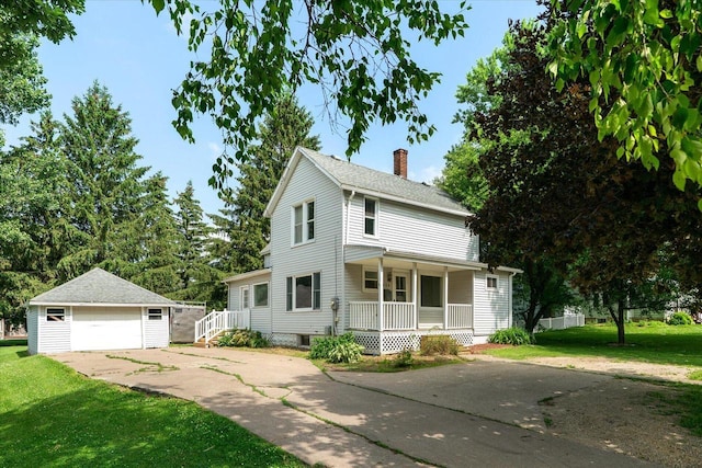 624 S Main St, Westby, WI 54667 - view of front of house with an outdoor structure, covered porch, a chimney, a detached garage, and a front lawn
