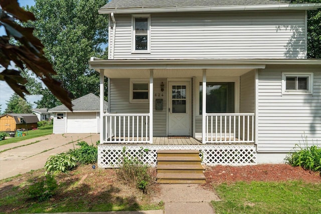 624 S Main St, Westby, WI 54667 - view of front of home with a porch, a garage, and a shingled roof