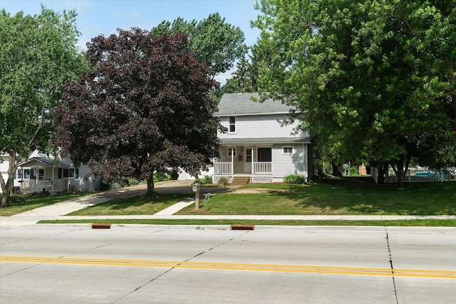 624 S Main St, Westby, WI 54667 - obstructed view of property featuring a porch and a front lawn