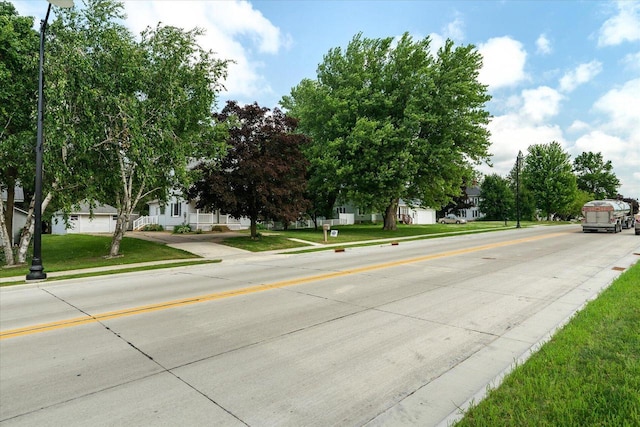 624 S Main St, Westby, WI 54667 - view of concrete road with curbs, sidewalks, and a residential view