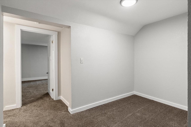 624 S Main St, Westby, WI 54667 - spare room featuring dark colored carpet and vaulted ceiling