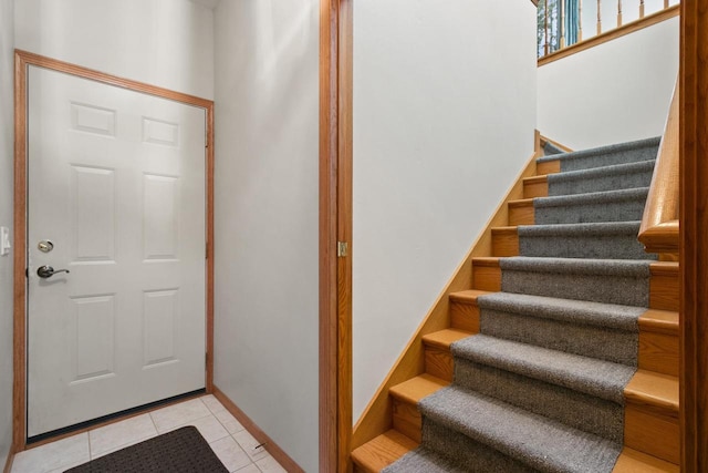 S7663 W Grandview Ave, Merrimac, WI 53561 - entrance foyer with stairway and light tile patterned floors