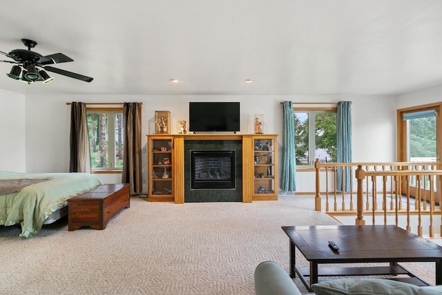 S7663 W Grandview Ave, Merrimac, WI 53561 - carpeted living area featuring a ceiling fan, a tile fireplace, and recessed lighting