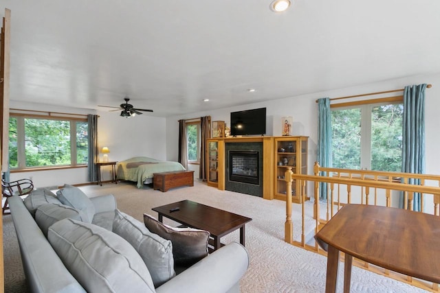 S7663 W Grandview Ave, Merrimac, WI 53561 - carpeted living room featuring a ceiling fan, a glass covered fireplace, and recessed lighting