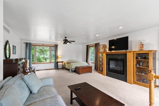 S7663 W Grandview Ave, Merrimac, WI 53561 - bedroom with a tiled fireplace, carpet, a ceiling fan, and recessed lighting