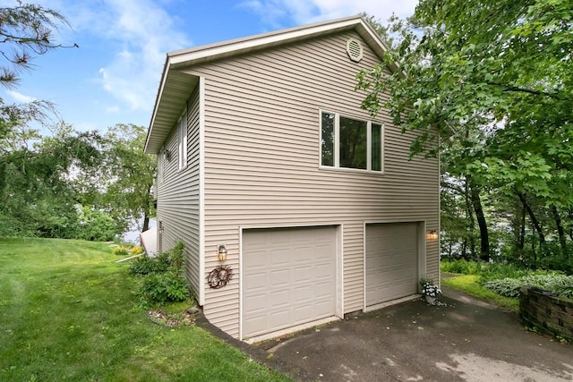 S7663 W Grandview Ave, Merrimac, WI 53561 - view of property exterior with an attached garage, driveway, and a yard