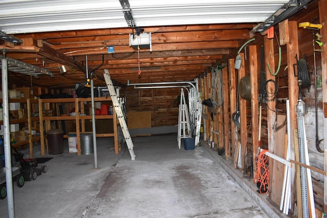 22630 Elm St, Cornucopia, WI 54827 - garage featuring a garage door opener