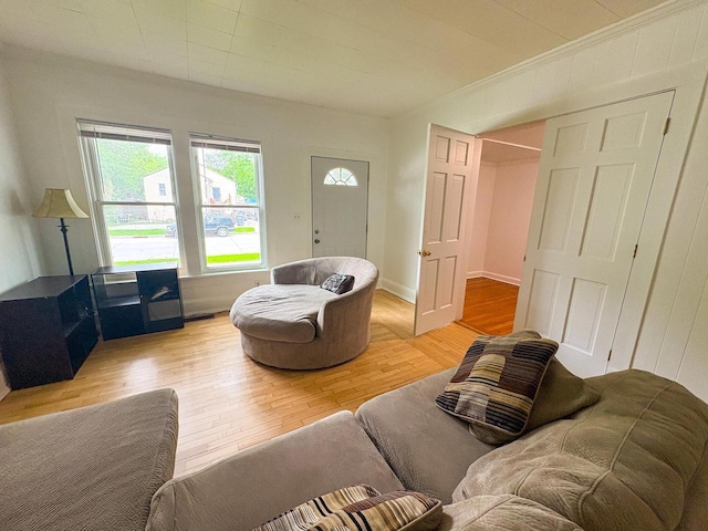 417 W 7th Ave, Oshkosh, WI 54902 - living area featuring light wood finished floors and ornamental molding