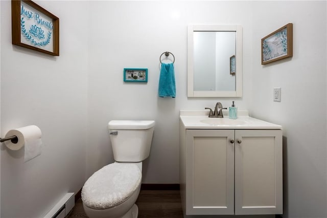 3950 Boardwalk St, Eau Claire, WI 54701 - half bath with baseboard heating, vanity, and wood finished floors