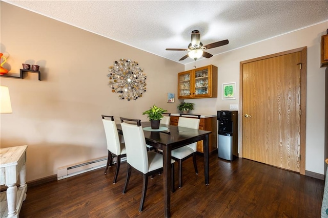 3950 Boardwalk St, Eau Claire, WI 54701 - dining area featuring ceiling fan, dark wood finished floors, a baseboard radiator, and a textured ceiling
