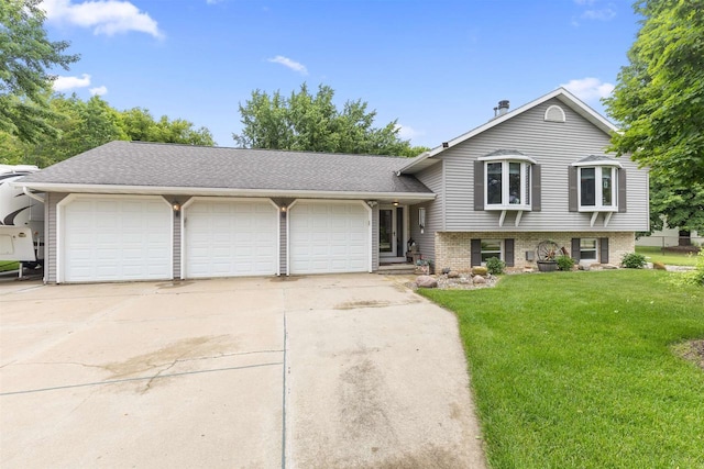 2570 Country Meadow Ct, Green Bay, WI 54313 - split level home with a front yard, concrete driveway, an attached garage, and a shingled roof