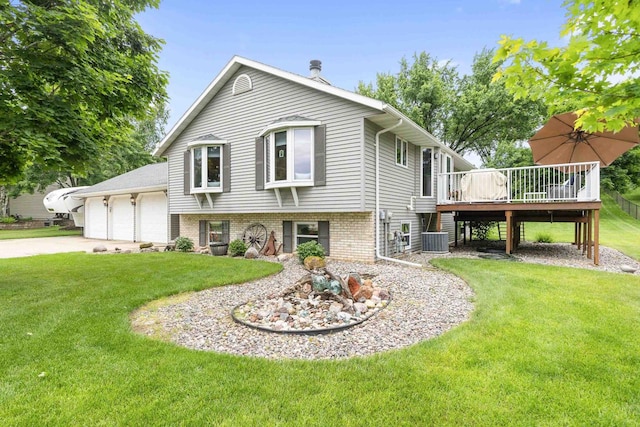 2570 Country Meadow Ct, Green Bay, WI 54313 - view of front facade with a front yard, a wooden deck, brick siding, and a garage