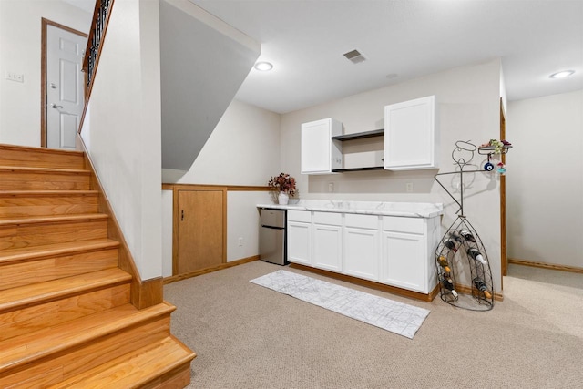 2570 Country Meadow Ct, Green Bay, WI 54313 - bar featuring freestanding refrigerator, light colored carpet, stairway, and recessed lighting