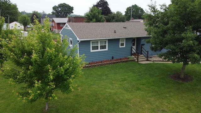 201 Chestnut Dr, Elroy, WI 53929 - view of front of property featuring a front yard and a shingled roof