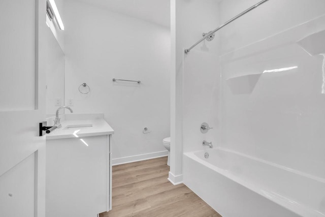 9352 S Alder Pl Unit 104, Oak Creek, WI 53154 - bathroom with vanity, washtub / shower combination, and wood finished floors