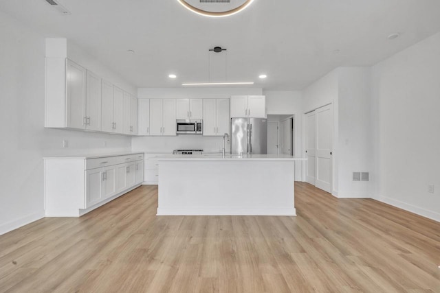 9352 S Alder Pl Unit 104, Oak Creek, WI 53154 - kitchen with stainless steel appliances, recessed lighting, white cabinetry, and light wood-type flooring