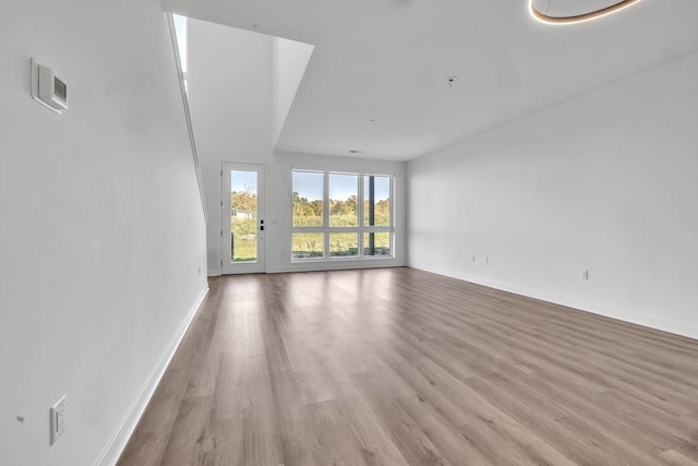 9352 S Alder Pl Unit 104, Oak Creek, WI 53154 - unfurnished living room with wood finished floors