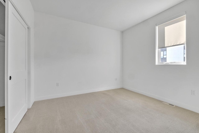 9352 S Alder Pl Unit 104, Oak Creek, WI 53154 - unfurnished bedroom featuring light colored carpet and a closet