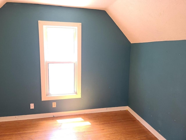852 8th St, Beloit, WI 53511 - bonus room featuring lofted ceiling and wood-type flooring