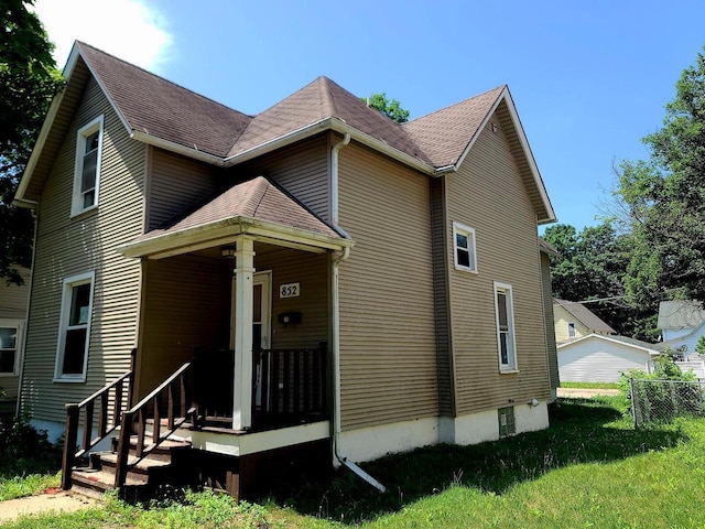 852 8th St, Beloit, WI 53511 - view of home's exterior featuring a shingled roof