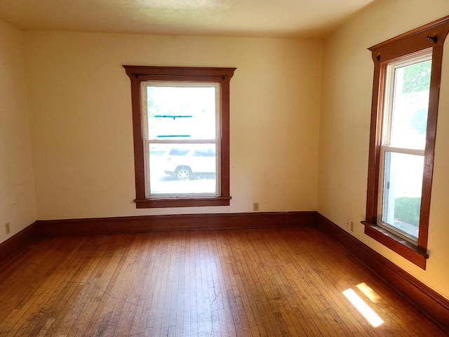 852 8th St, Beloit, WI 53511 - spare room with healthy amount of natural light and hardwood / wood-style flooring
