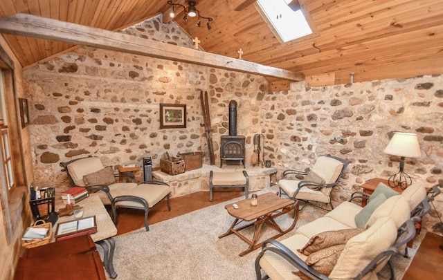 823 E Brandybrook Rd, Wales, WI 53183 - living area featuring wooden ceiling, a wood stove, and a skylight