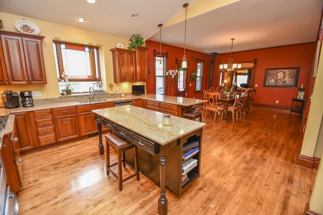823 E Brandybrook Rd, Wales, WI 53183 - kitchen featuring a chandelier, light wood-style flooring, a peninsula, dishwasher, and hanging light fixtures