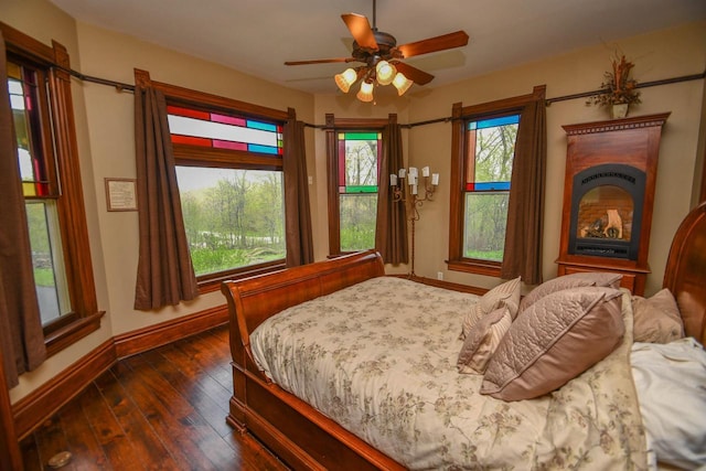 823 E Brandybrook Rd, Wales, WI 53183 - bedroom with multiple windows, dark wood-type flooring, and ceiling fan