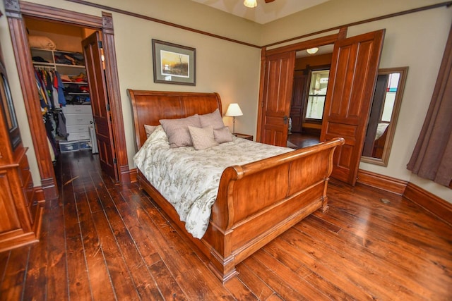 823 E Brandybrook Rd, Wales, WI 53183 - bedroom featuring dark wood finished floors, a spacious closet, and a closet