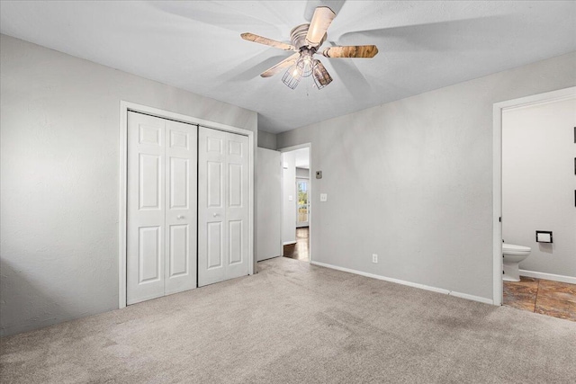 10824 W Donna Dr, Milwaukee, WI 53224 - unfurnished bedroom featuring carpet, a closet, connected bathroom, and a ceiling fan