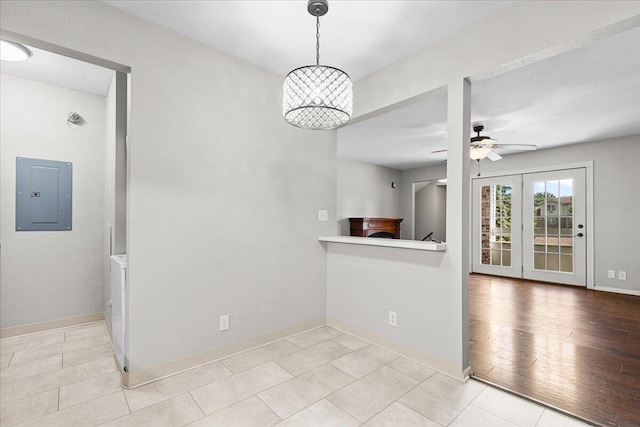 10824 W Donna Dr, Milwaukee, WI 53224 - unfurnished dining area with electric panel, ceiling fan, and light tile patterned floors