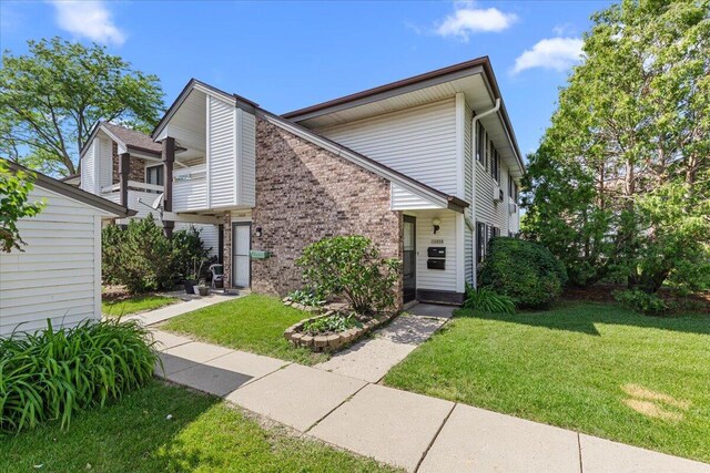 10824 W Donna Dr, Milwaukee, WI 53224 - view of front of home featuring a front lawn