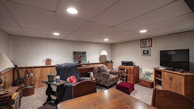 132 N Eagle St, Oshkosh, WI 54902 - living area with carpet floors, a paneled ceiling, wooden walls, recessed lighting, and a wainscoted wall