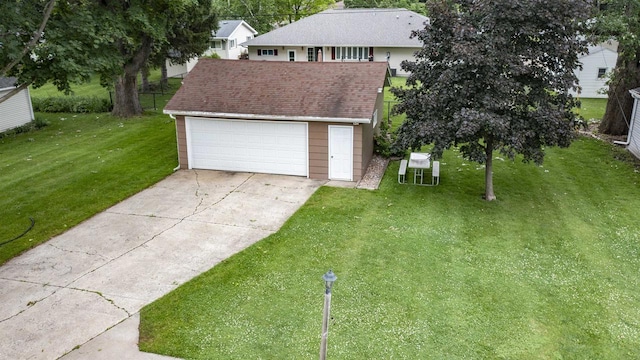 132 N Eagle St, Oshkosh, WI 54902 - view of front of house featuring a front yard, a detached garage, an outbuilding, and roof with shingles