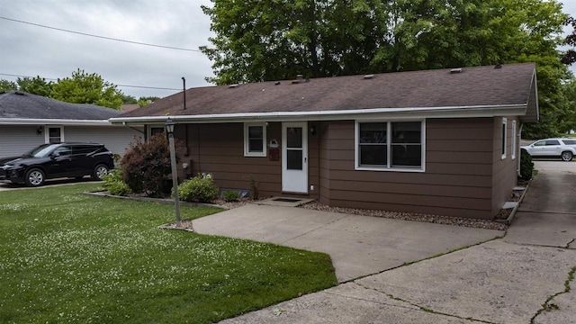 132 N Eagle St, Oshkosh, WI 54902 - view of front of property featuring a front lawn and a shingled roof