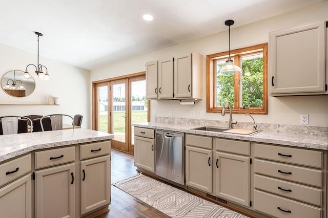 810 Capman St, Milton, WI 53563 - kitchen featuring stainless steel dishwasher, healthy amount of natural light, light countertops, hanging light fixtures, and recessed lighting