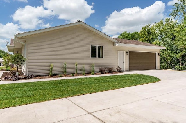 810 Capman St, Milton, WI 53563 - view of front of home featuring a garage, driveway, and a front lawn