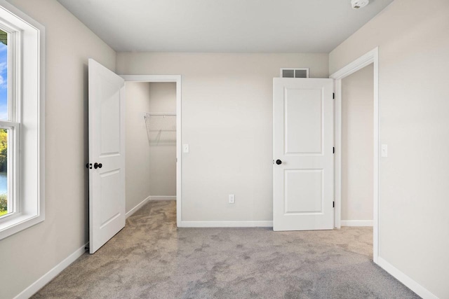 N6220 Blarney Stone Dr Unit 53, Albany, WI 53520 - unfurnished bedroom featuring carpet floors and a spacious closet